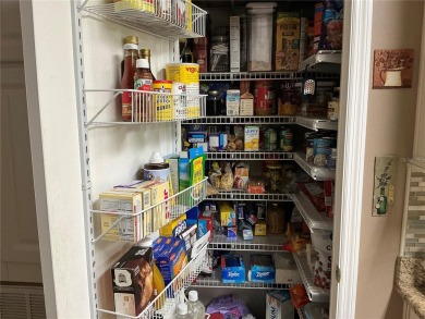 This home truly has it all! Attached RV port built to on Lily Lake Golf and RV Resort in Florida - for sale on GolfHomes.com, golf home, golf lot