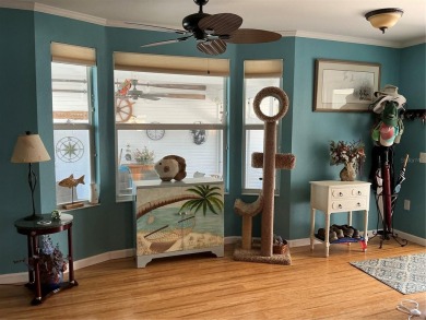 This home truly has it all! Attached RV port built to on Lily Lake Golf and RV Resort in Florida - for sale on GolfHomes.com, golf home, golf lot
