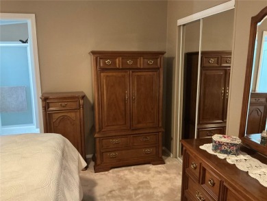 This home truly has it all! Attached RV port built to on Lily Lake Golf and RV Resort in Florida - for sale on GolfHomes.com, golf home, golf lot