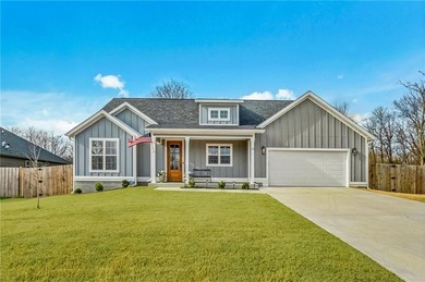 Situated perfectly on a rare FLAT double lot totaling over half on Bella Vista Country Club - Highlands in Arkansas - for sale on GolfHomes.com, golf home, golf lot