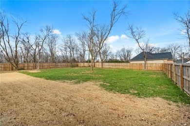 Situated perfectly on a rare FLAT double lot totaling over half on Bella Vista Country Club - Highlands in Arkansas - for sale on GolfHomes.com, golf home, golf lot