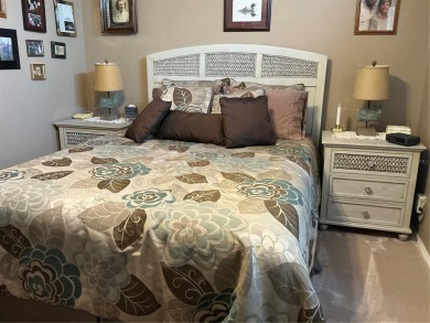 This home truly has it all! Attached RV port built to on Lily Lake Golf and RV Resort in Florida - for sale on GolfHomes.com, golf home, golf lot