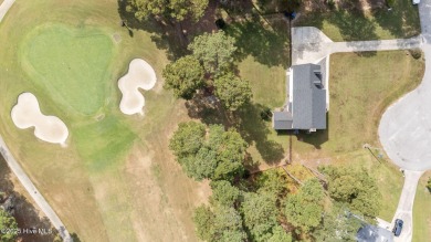 Welcome home to 4804 Burning Tree Lane North, a stately home set on Wilson Country Club in North Carolina - for sale on GolfHomes.com, golf home, golf lot
