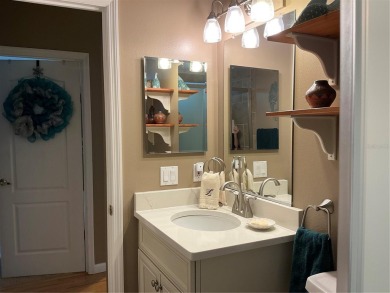 This home truly has it all! Attached RV port built to on Lily Lake Golf and RV Resort in Florida - for sale on GolfHomes.com, golf home, golf lot
