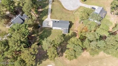 Welcome home to 4804 Burning Tree Lane North, a stately home set on Wilson Country Club in North Carolina - for sale on GolfHomes.com, golf home, golf lot