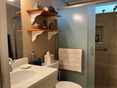 This home truly has it all! Attached RV port built to on Lily Lake Golf and RV Resort in Florida - for sale on GolfHomes.com, golf home, golf lot
