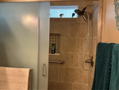 This home truly has it all! Attached RV port built to on Lily Lake Golf and RV Resort in Florida - for sale on GolfHomes.com, golf home, golf lot