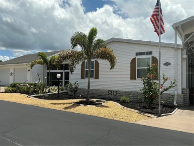 This home truly has it all! Attached RV port built to on Lily Lake Golf and RV Resort in Florida - for sale on GolfHomes.com, golf home, golf lot
