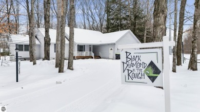 Nestled amidst four-season splendor, this home spans over 3100 on Schuss Mountain Golf Club in Michigan - for sale on GolfHomes.com, golf home, golf lot