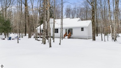 Nestled amidst four-season splendor, this home spans over 3100 on Schuss Mountain Golf Club in Michigan - for sale on GolfHomes.com, golf home, golf lot