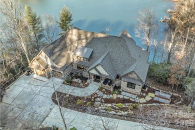 Set along the pristine shoreline of Ticoa Lake in the highly on Connestee Falls Golf Club in North Carolina - for sale on GolfHomes.com, golf home, golf lot