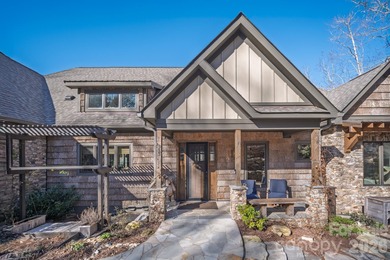 Set along the pristine shoreline of Ticoa Lake in the highly on Connestee Falls Golf Club in North Carolina - for sale on GolfHomes.com, golf home, golf lot