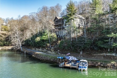 Set along the pristine shoreline of Ticoa Lake in the highly on Connestee Falls Golf Club in North Carolina - for sale on GolfHomes.com, golf home, golf lot