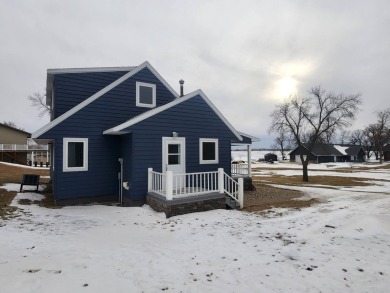 Roy Lake back lot home located on Roykota Dr. Lake City, SD with on Roy View Golf Course in South Dakota - for sale on GolfHomes.com, golf home, golf lot