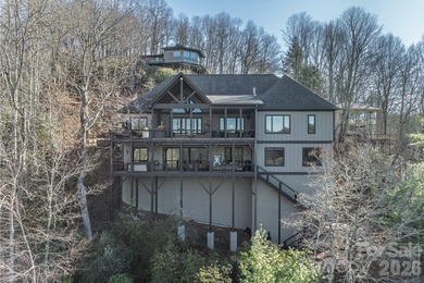 Set along the pristine shoreline of Ticoa Lake in the highly on Connestee Falls Golf Club in North Carolina - for sale on GolfHomes.com, golf home, golf lot