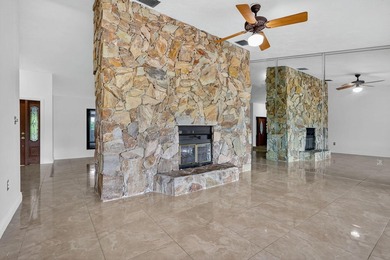 Stunning 4BR/2BA waterfront pool home in prestigious Country on  in Florida - for sale on GolfHomes.com, golf home, golf lot