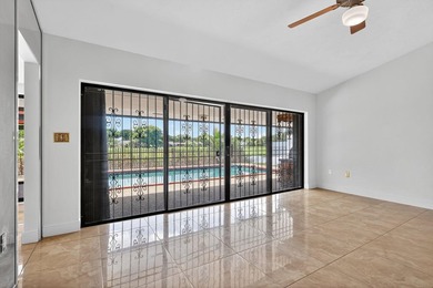 Stunning 4BR/2BA waterfront pool home in prestigious Country on  in Florida - for sale on GolfHomes.com, golf home, golf lot