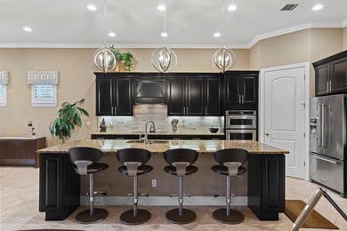 Immaculate custom-built lakefront home in the gated Copperleaf on Evergreen Club in Florida - for sale on GolfHomes.com, golf home, golf lot