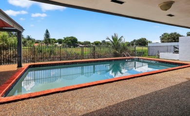 Stunning 4BR/2BA waterfront pool home in prestigious Country on Country Club of Miami in Florida - for sale on GolfHomes.com, golf home, golf lot