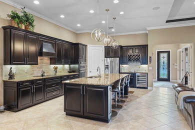 Immaculate custom-built lakefront home in the gated Copperleaf on Evergreen Club in Florida - for sale on GolfHomes.com, golf home, golf lot