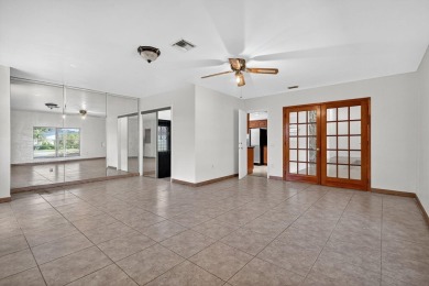 Stunning 4BR/2BA waterfront pool home in prestigious Country on Country Club of Miami in Florida - for sale on GolfHomes.com, golf home, golf lot