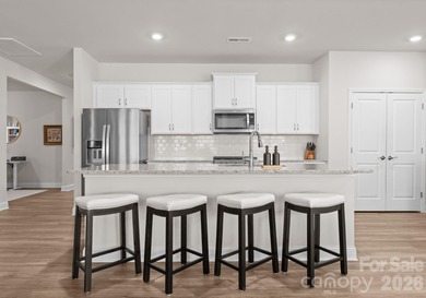 Welcome home to this stunning ranch on a corner lot, built in on Fort Mill Golf Club in South Carolina - for sale on GolfHomes.com, golf home, golf lot