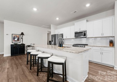 Welcome home to this stunning ranch on a corner lot, built in on Fort Mill Golf Club in South Carolina - for sale on GolfHomes.com, golf home, golf lot