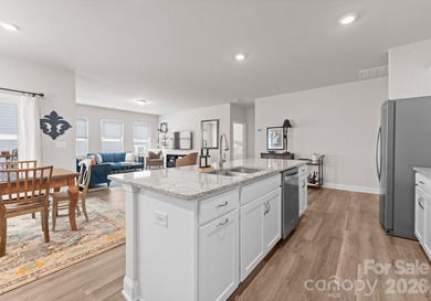 Welcome home to this stunning ranch on a corner lot, built in on Fort Mill Golf Club in South Carolina - for sale on GolfHomes.com, golf home, golf lot