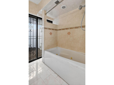 Stunning 4BR/2BA waterfront pool home in prestigious Country on Country Club of Miami in Florida - for sale on GolfHomes.com, golf home, golf lot