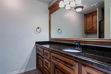 Nestled in the prestigious Oak Tree community.  Well designed on Oak Tree National Golf and Country Club in Oklahoma - for sale on GolfHomes.com, golf home, golf lot