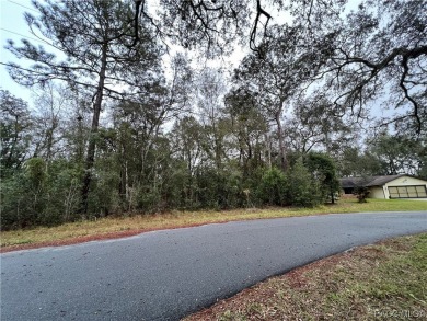 Who doesn't love a nice, oversized wooded lot, almost a half on Citrus Springs Country Club in Florida - for sale on GolfHomes.com, golf home, golf lot
