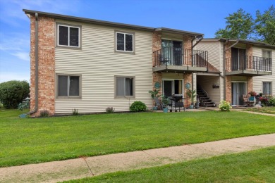 Introducing this charming first floor, end unit condo with a on BlackStone Creek Golf Club in Wisconsin - for sale on GolfHomes.com, golf home, golf lot