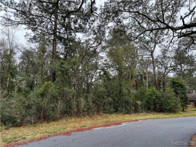 Who doesn't love a nice, oversized wooded lot, almost a half on Citrus Springs Country Club in Florida - for sale on GolfHomes.com, golf home, golf lot