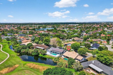 Stunning 4BR/2BA waterfront pool home in prestigious Country on Country Club of Miami in Florida - for sale on GolfHomes.com, golf home, golf lot