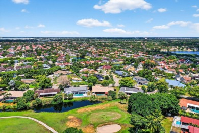 Stunning 4BR/2BA waterfront pool home in prestigious Country on Country Club of Miami in Florida - for sale on GolfHomes.com, golf home, golf lot