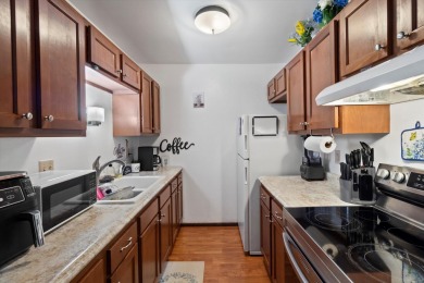 Introducing this charming first floor, end unit condo with a on BlackStone Creek Golf Club in Wisconsin - for sale on GolfHomes.com, golf home, golf lot
