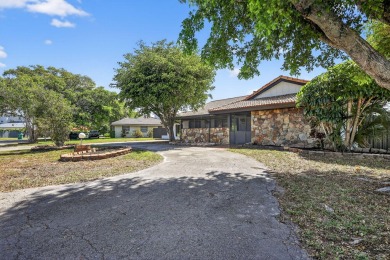 Stunning 4BR/2BA waterfront pool home in prestigious Country on Country Club of Miami in Florida - for sale on GolfHomes.com, golf home, golf lot