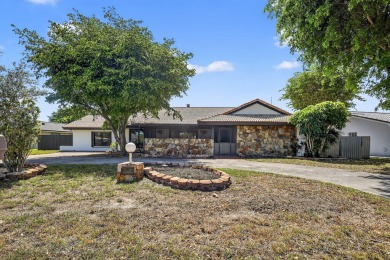 Stunning 4BR/2BA waterfront pool home in prestigious Country on Country Club of Miami in Florida - for sale on GolfHomes.com, golf home, golf lot