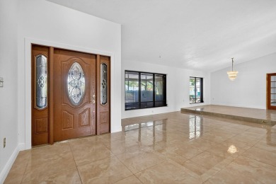 Stunning 4BR/2BA waterfront pool home in prestigious Country on Country Club of Miami in Florida - for sale on GolfHomes.com, golf home, golf lot