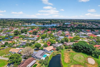 Stunning 4BR/2BA waterfront pool home in prestigious Country on Country Club of Miami in Florida - for sale on GolfHomes.com, golf home, golf lot