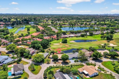 Stunning 4BR/2BA waterfront pool home in prestigious Country on Country Club of Miami in Florida - for sale on GolfHomes.com, golf home, golf lot