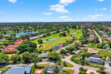 Stunning 4BR/2BA waterfront pool home in prestigious Country on Country Club of Miami in Florida - for sale on GolfHomes.com, golf home, golf lot
