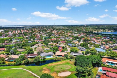 Stunning 4BR/2BA waterfront pool home in prestigious Country on Country Club of Miami in Florida - for sale on GolfHomes.com, golf home, golf lot