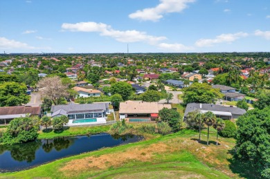 Stunning 4BR/2BA waterfront pool home in prestigious Country on Country Club of Miami in Florida - for sale on GolfHomes.com, golf home, golf lot