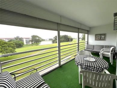 Imagine Sipping your Coffee Enjoying this Wide WATER/GOLF VIEW on Wynmoor Golf Course in Florida - for sale on GolfHomes.com, golf home, golf lot