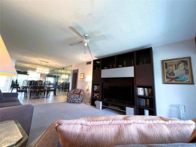 Imagine Sipping your Coffee Enjoying this Wide WATER/GOLF VIEW on Wynmoor Golf Course in Florida - for sale on GolfHomes.com, golf home, golf lot