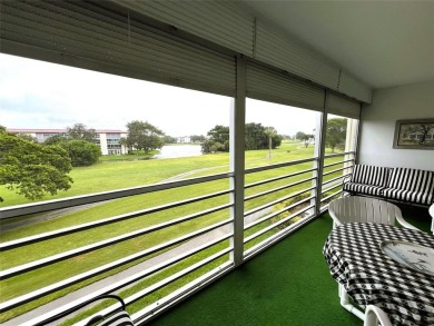 Imagine Sipping your Coffee Enjoying this Wide WATER/GOLF VIEW on Wynmoor Golf Course in Florida - for sale on GolfHomes.com, golf home, golf lot