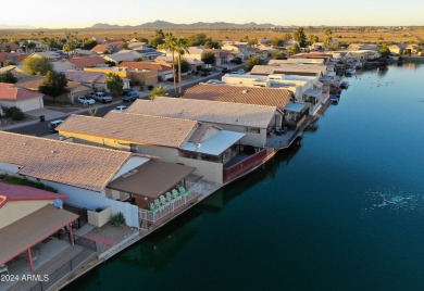 Adorable patio home on Casa Grande Lakes. High ceilings. Bright on Dave White Reg Park and Golf Course in Arizona - for sale on GolfHomes.com, golf home, golf lot