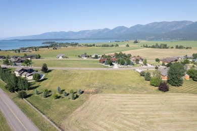 Discover your dream home site on .72 acres with breathtaking on Polson Bay Golf Course - Championship Course in Montana - for sale on GolfHomes.com, golf home, golf lot