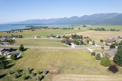 Discover your dream home site on .72 acres with breathtaking on Polson Bay Golf Course - Championship Course in Montana - for sale on GolfHomes.com, golf home, golf lot